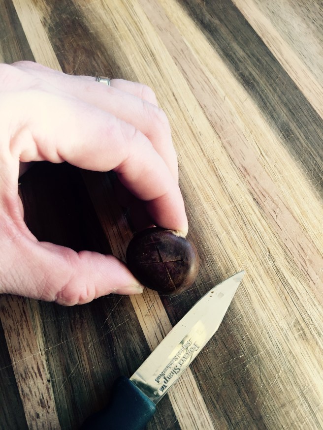 Scoring chestnuts with a knife